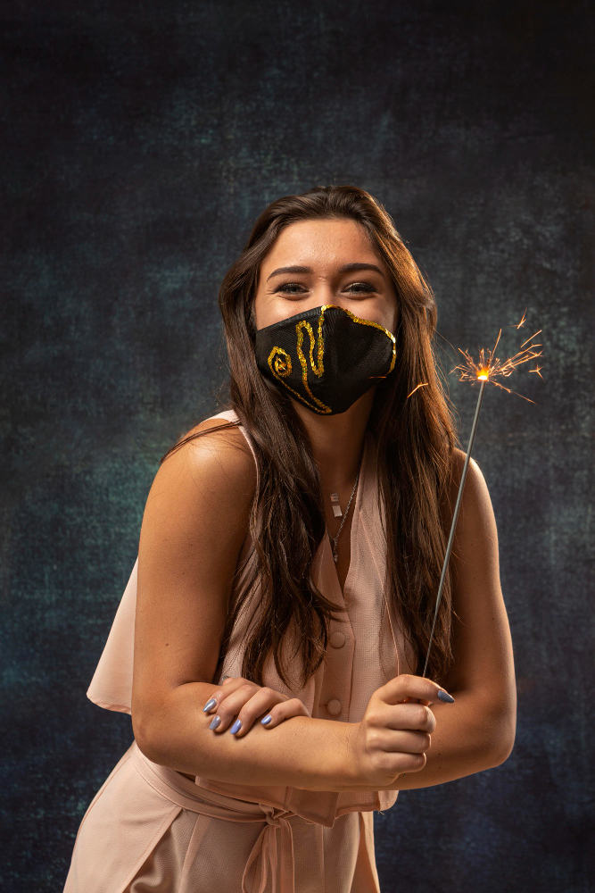 front-view-woman-wearing-mask-with-firework