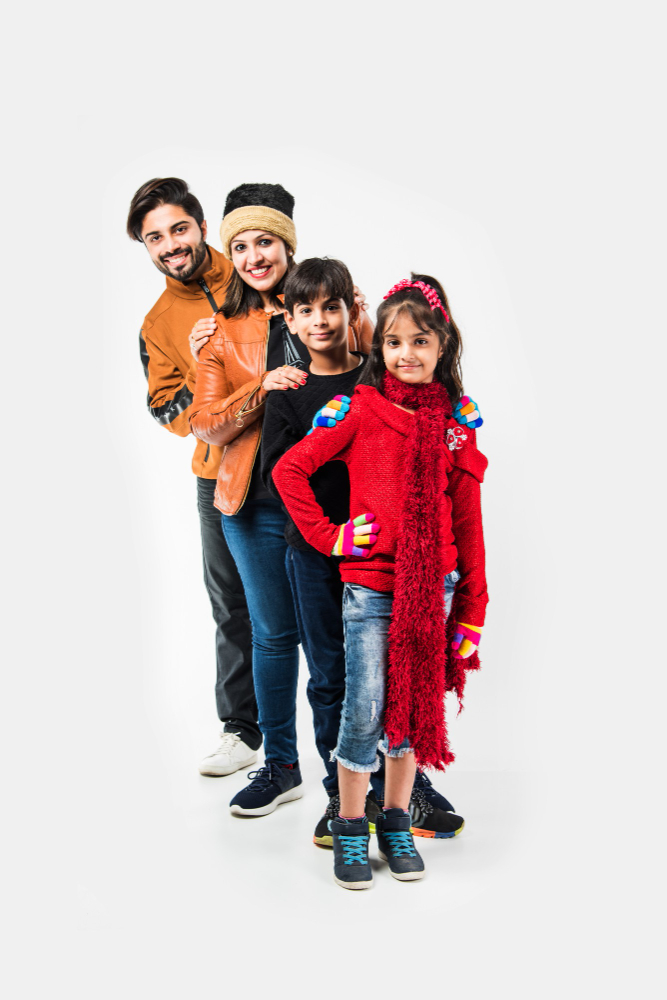 indian-family-warm-clothes-standing-against-white-background-ready-winter